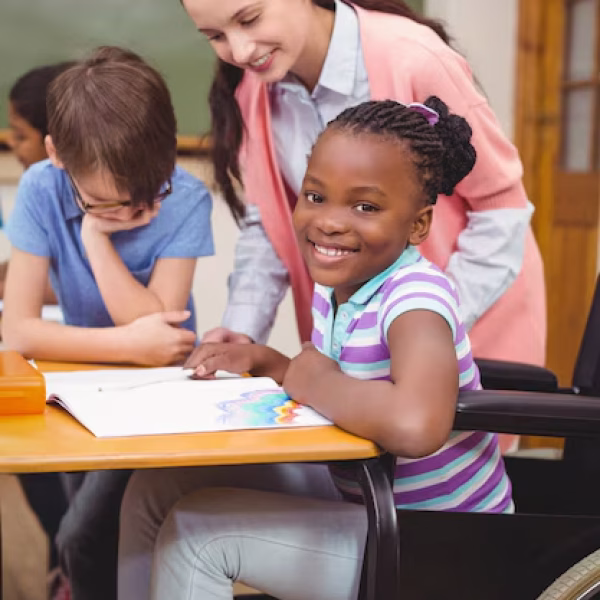 disabled-pupil-smiling-camera-classroom_13339-191507